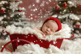 festive newborn setup with red wagon in winter wonderland, christmas photo prop for baby portraits