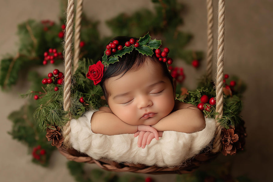 holiday newborn portrait with rustic christmas digital backdrop in studio setting