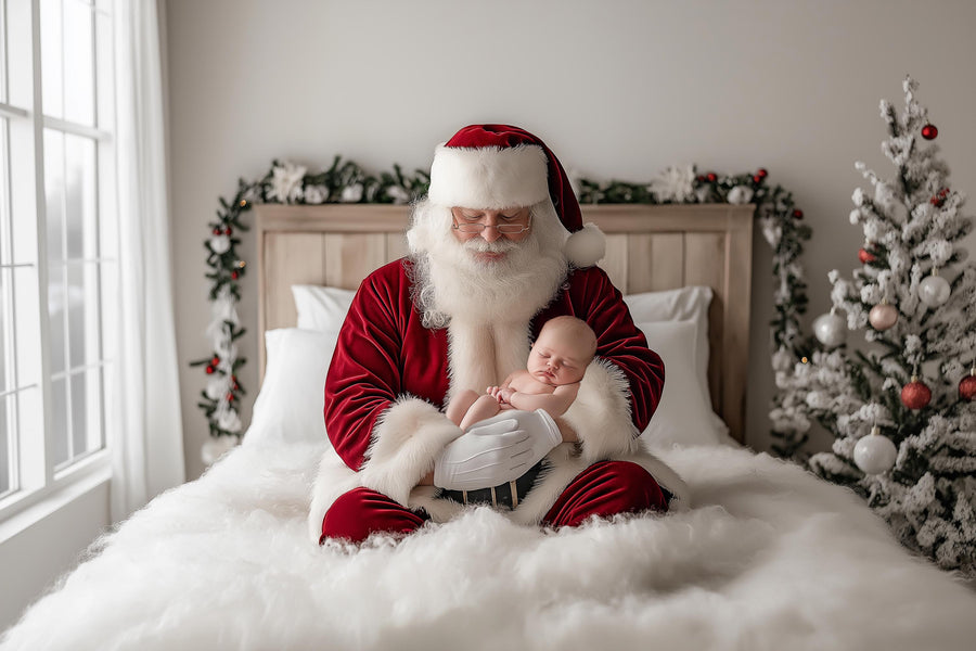 newborn and kids in christmas scene with santa and winter backdrop for holiday portraits