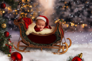 newborn resting in santa's sleigh with winter wonderland background, perfect for christmas portrait