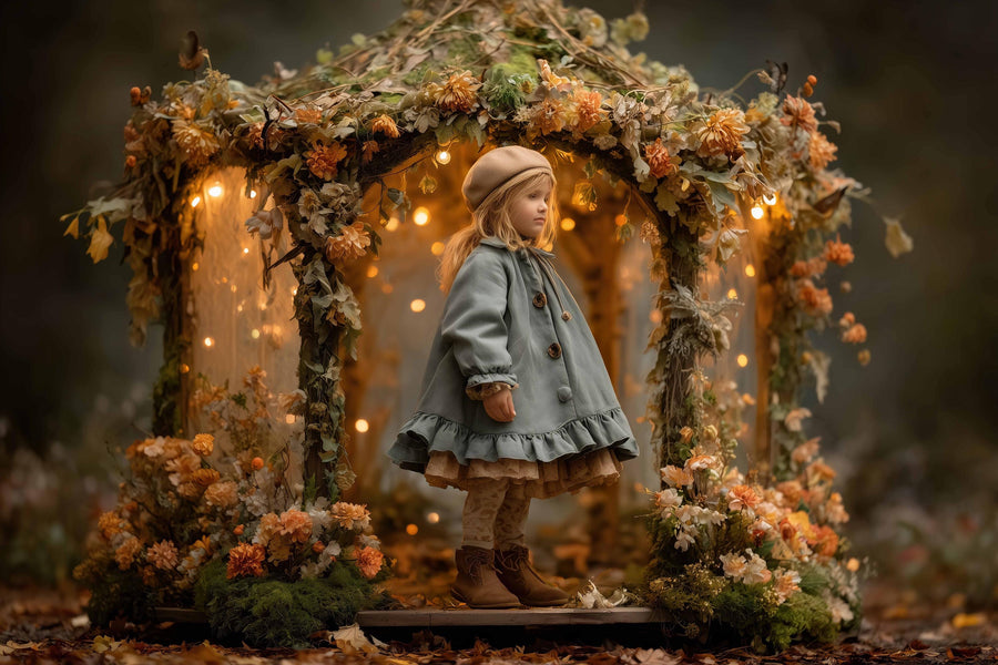 scene of a fairy light garden with fall leaves and floral backdrop, ideal for kids photo shoots