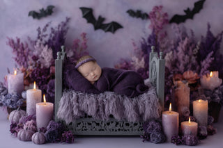baby girl in halloween costume on digital backdrop with bats and candles, perfect for fall photo sessions