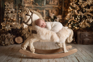 baby with rocking horse in cozy christmas scene, digital backdrop for holiday portraits