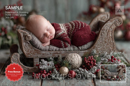 newborn sleeping on digital christmas backdrop with santa sleigh in festive studio setting