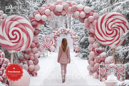 scene of a pink candy cane arch in a winter wonderland backdrop, perfect for holiday kids photo shoots